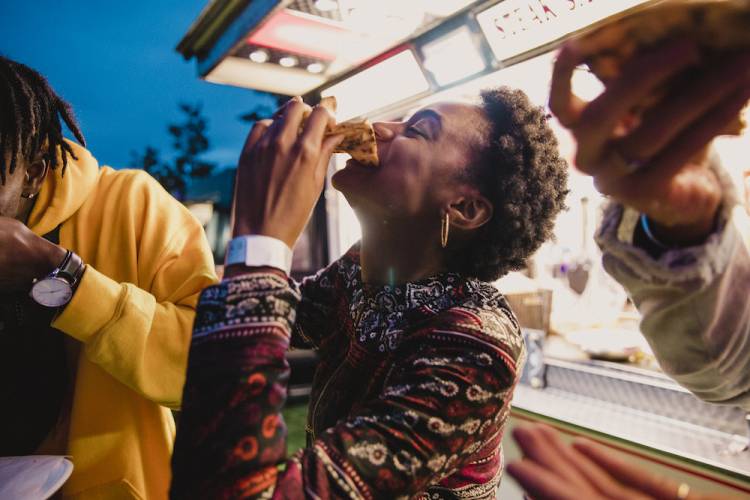 people eating food at a food truck