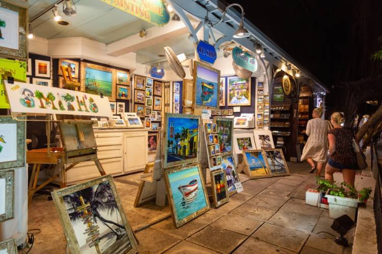 First Friday Art Walk in St. Augustine people looking at art during St. Augustine's First Friday Art Walk
