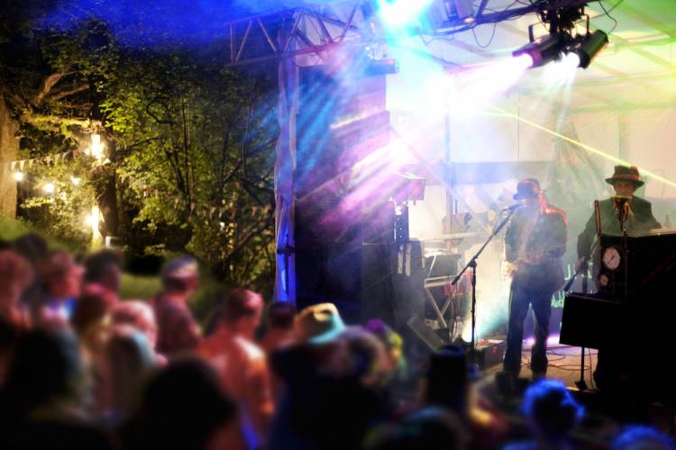 lit stage at an outdoor concert