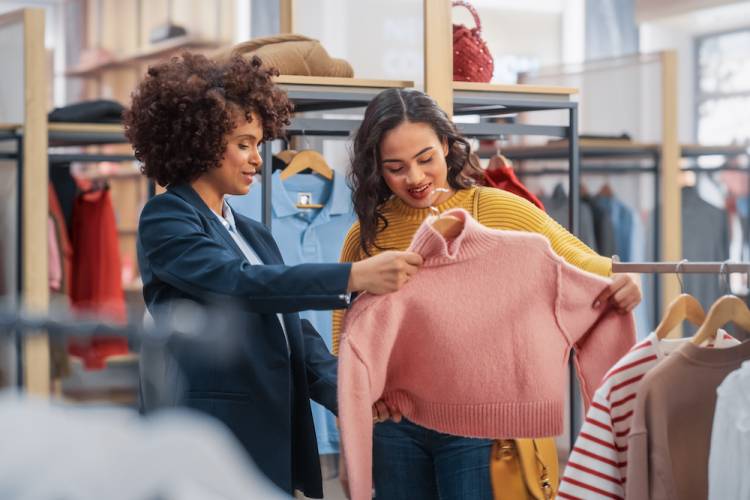 two women shopping in an outlet store