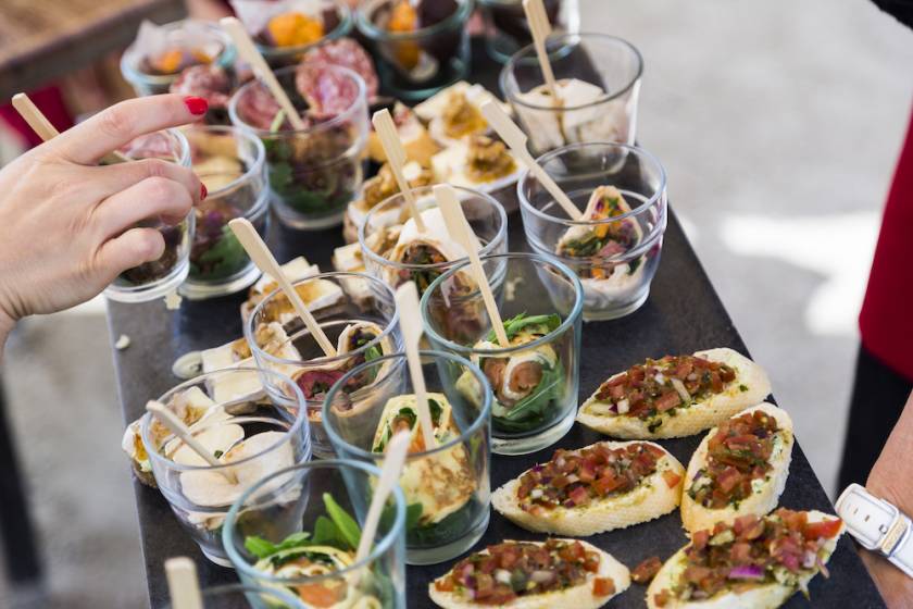 small food samples displayed at a festival