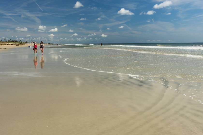two girls walking along beach in St. Augustine